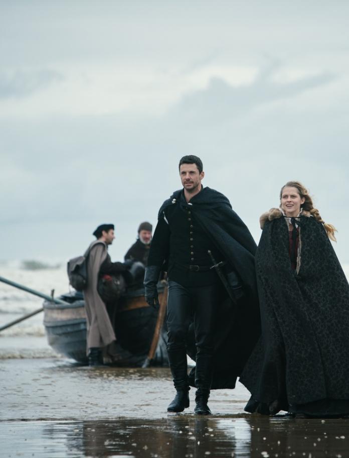 Main characters Diana Bishop and Matthew Goode on the beach.