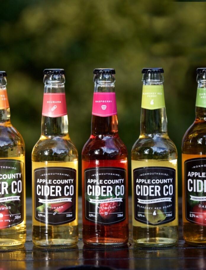 Five bottles of cider labelled Apple County Cider Co.