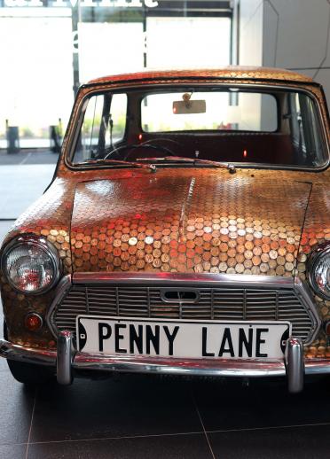 A Mini covered in coins at The Royal Mint Experience.