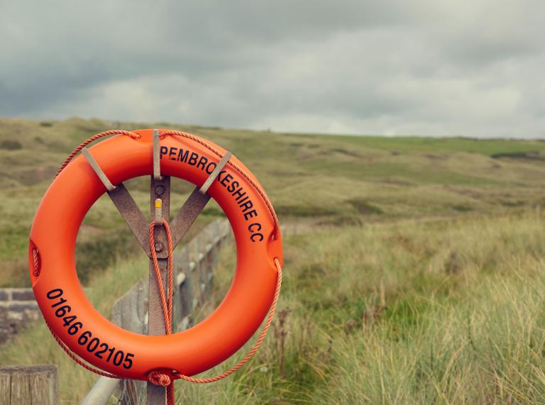 Orange life ring in Freshwater West, Pembrokeshire