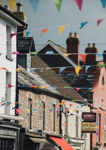 Image of colourful houses and shops with colourful bunting