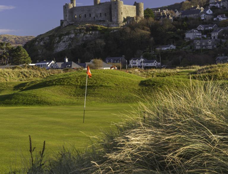 View across golf course towards Harlech Castle at Royal St David's Golf Club.