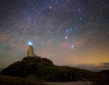 dark skies above lighthouse.