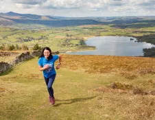 runner with lake in background.