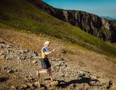 runner running down mountain.