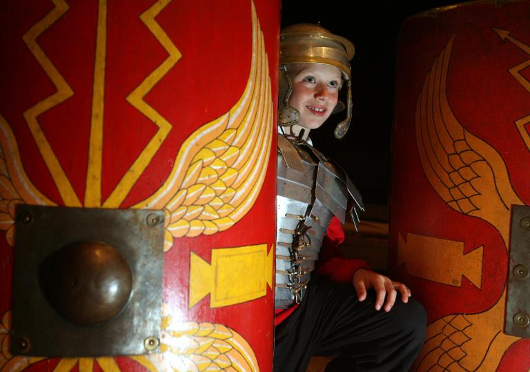 child dressed in Roman custom.