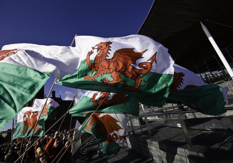 Welsh flags against a blue sky