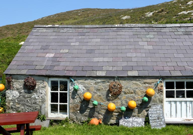 A buoy-strewn and characterful cottage on Bardsey Island.