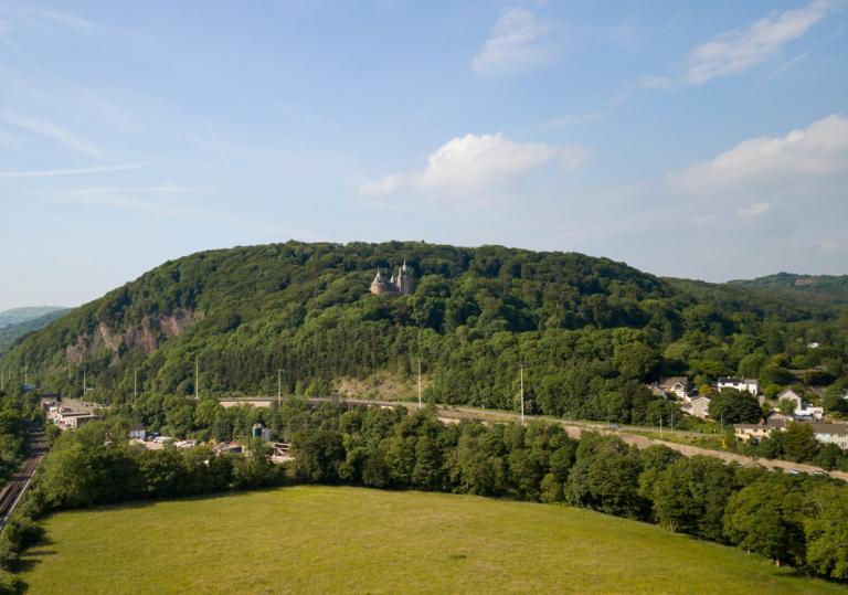 Landscape view with Castell Coch in the woods on the hill.