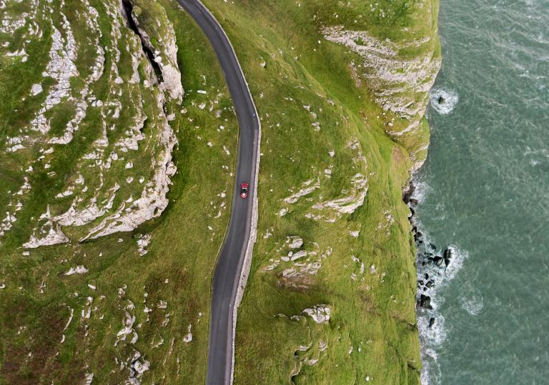 Aerial shot of car on road on the Great Orme.