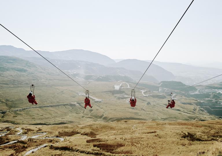 Four people on a zipwire.