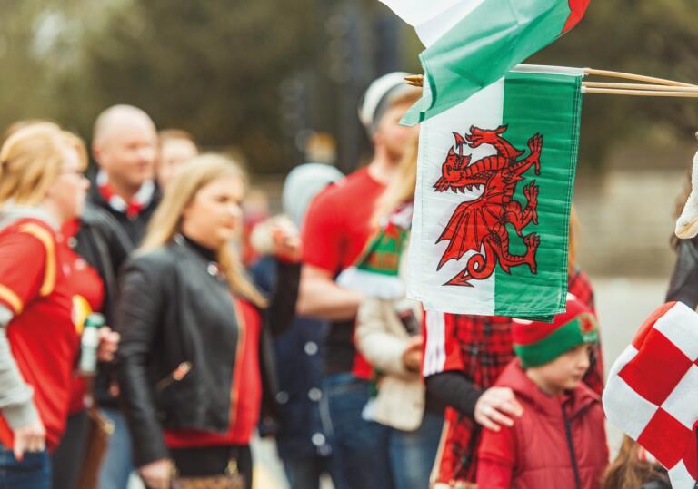 crowd and Welsh flag.