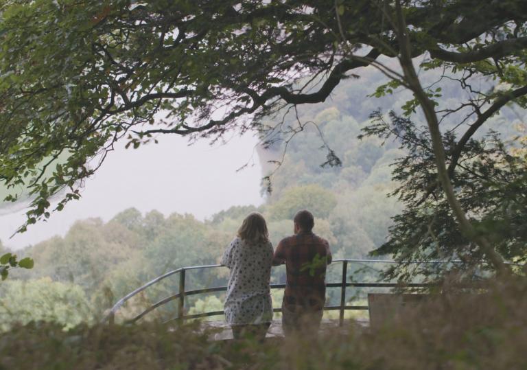 View of Nina and Joe Howden at The Eagle’s Nest, a viewpoint in the Wye Valley.