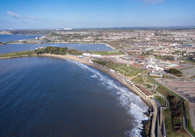 Barry Island from above showing funfair and beach