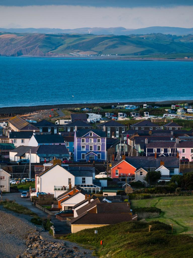 View of Aberaeron and its colourful houses in front of the sea.