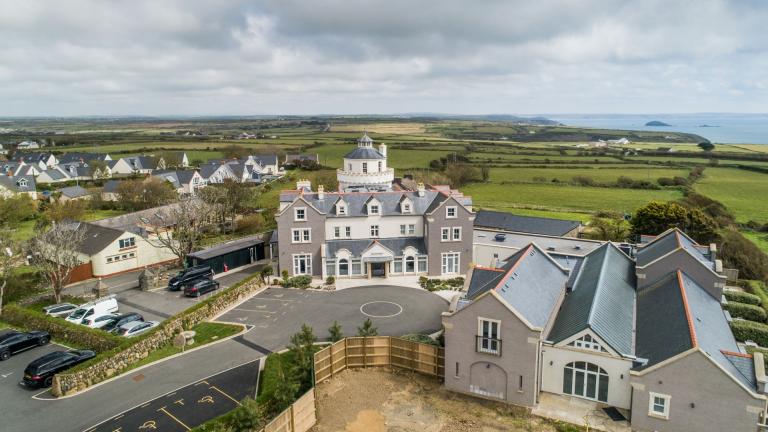 An aerial shot of Twr y Felin Hotel with the Pembrokeshire coast in the background.
