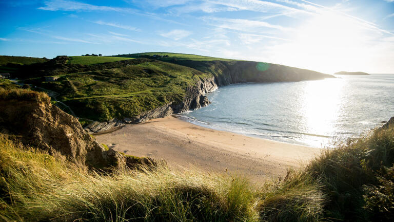 Mwnt beach and the sea, with the surrounding hillside