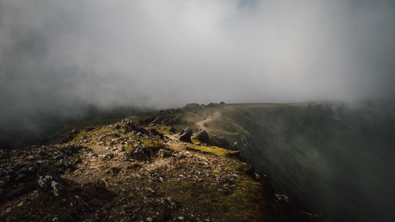 Mist on a mountain ridge path.