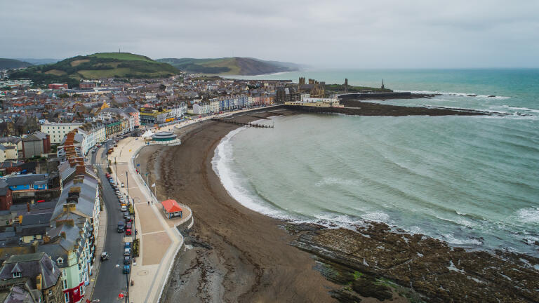 View from above of the seafront and promenade of Aberystwyth.