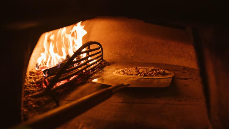 Pizza being cooked in the pizza oven.