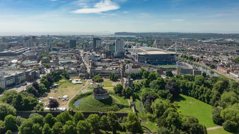 Aerial view of a city park, castle and stadium.