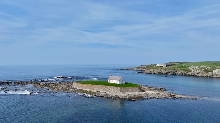 A small church on an island surrounded by sea