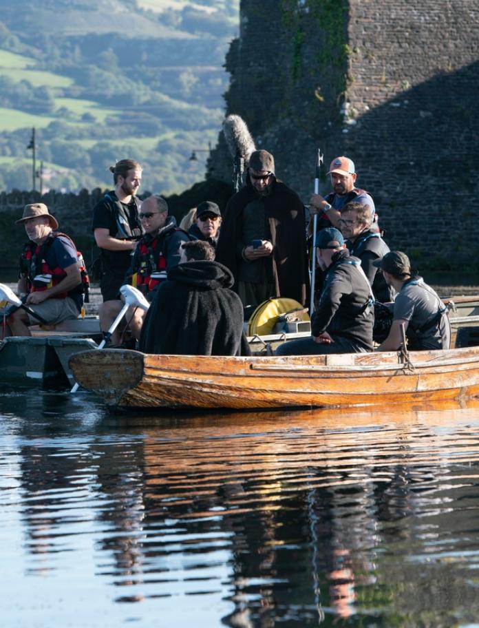 The film crew on a boat in the moat at Caerphilly Castle.