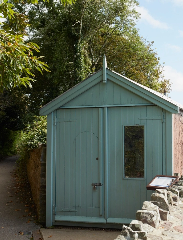 A writing shed looking out over an estuary.