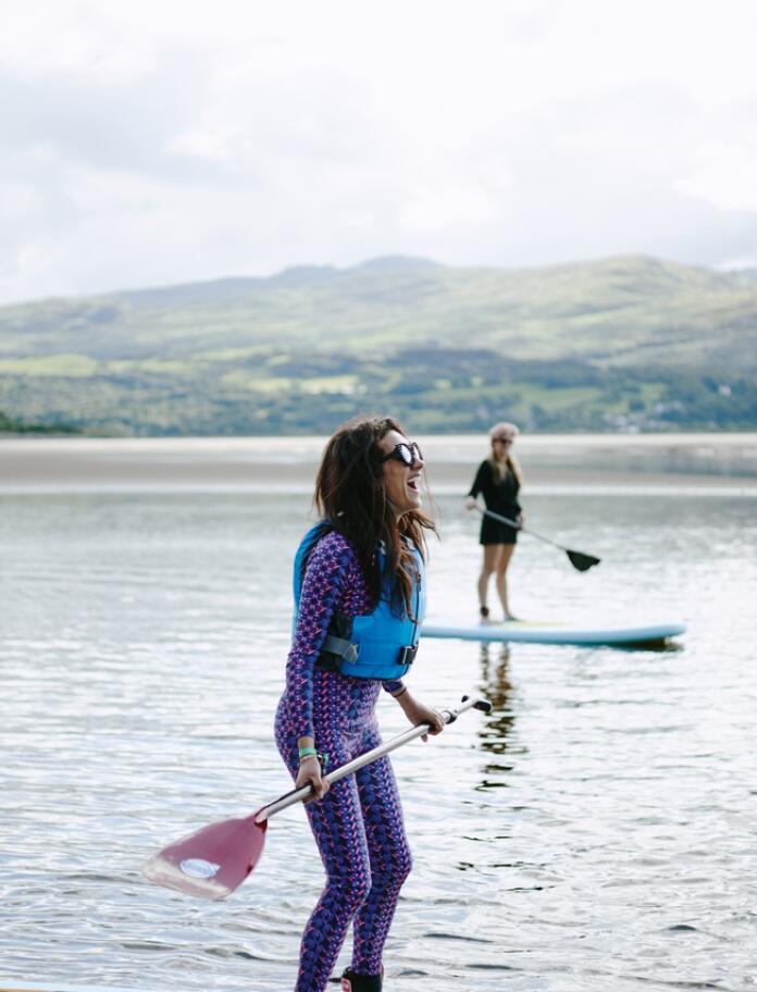 two female paddleboarders.