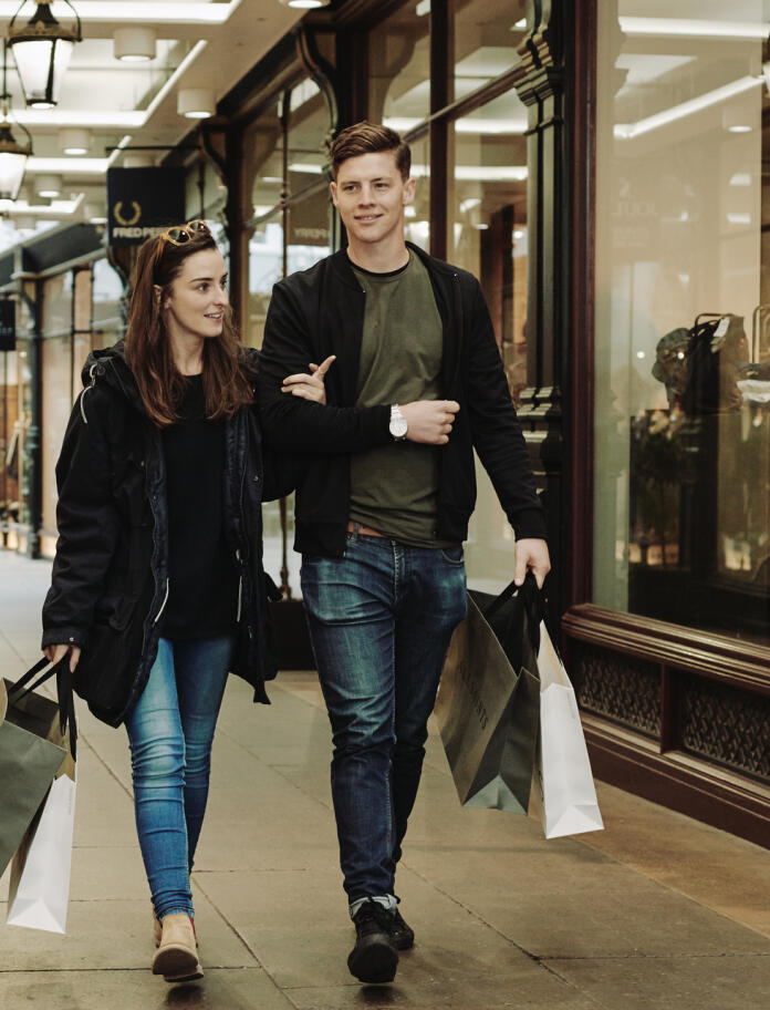 Couple shopping in Morgan Arcade, Cardiff.