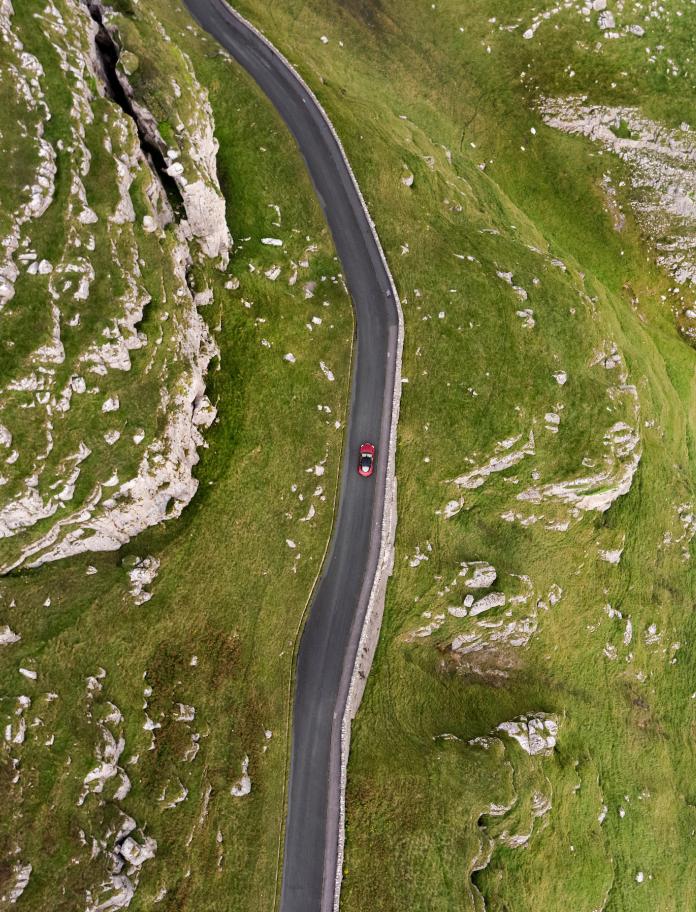 Aerial shot of car on road on the Great Orme.