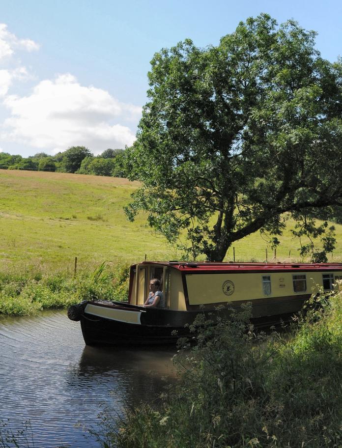 Canal boat on water at Monmouthshire &  Brecon Canal.