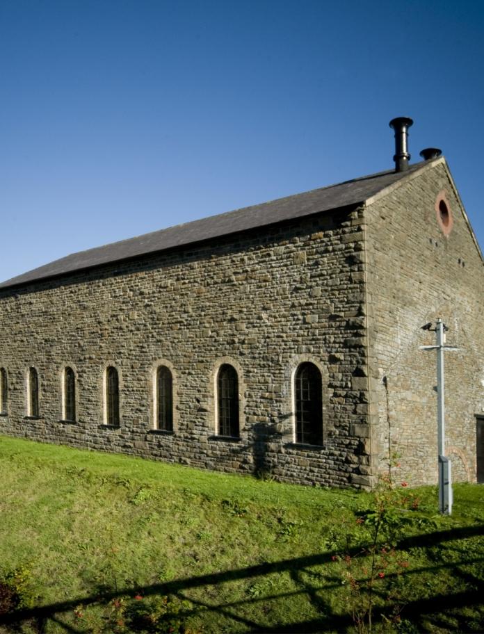 exterior view of stone building.