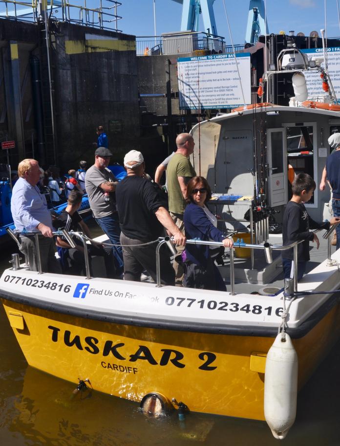 Tuskar 2 boat in the dock with people on board.