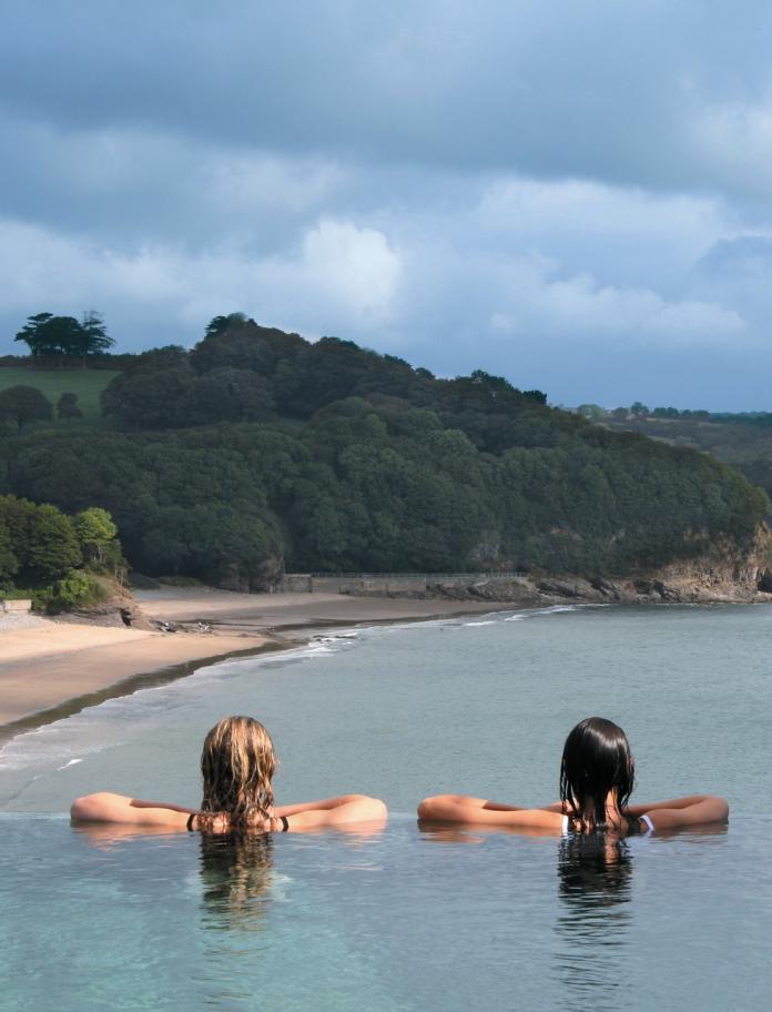 Two women looking out over the infinity pool at St Brides Spa.