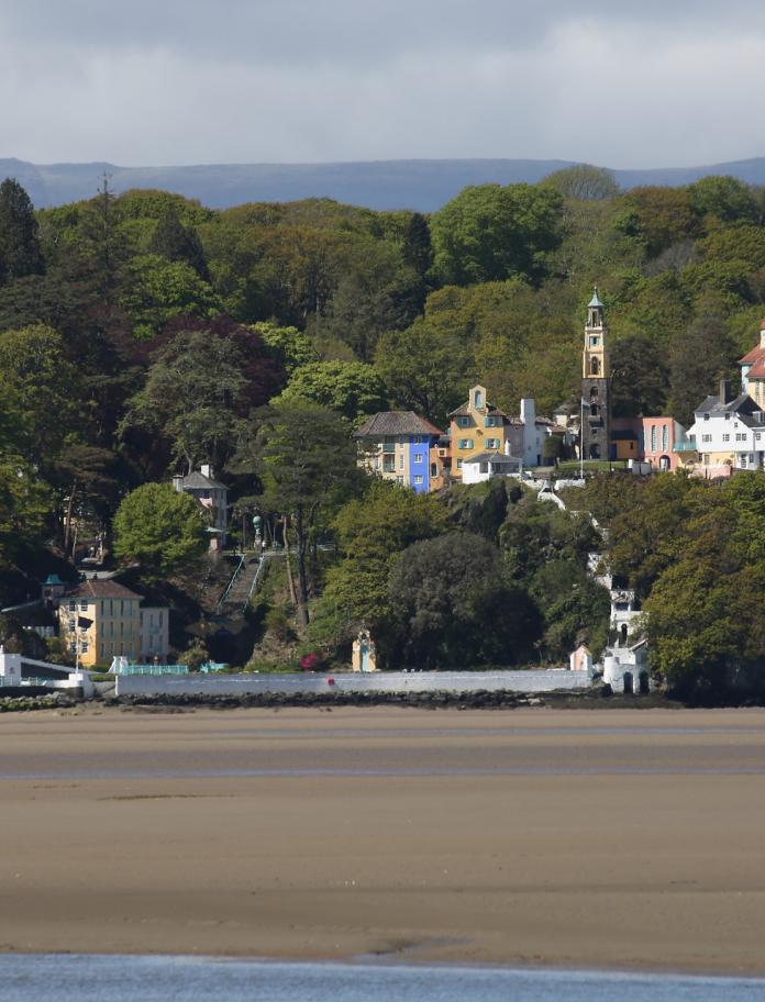Portmeirion hidden in the trees, view from over the river