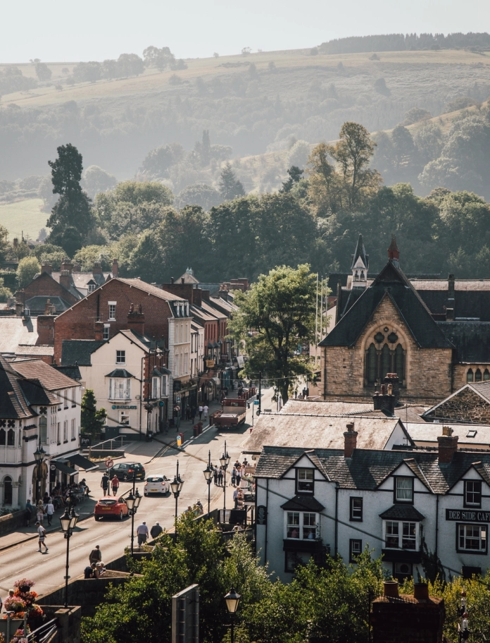 review of town from elevated position, with countryside in background.