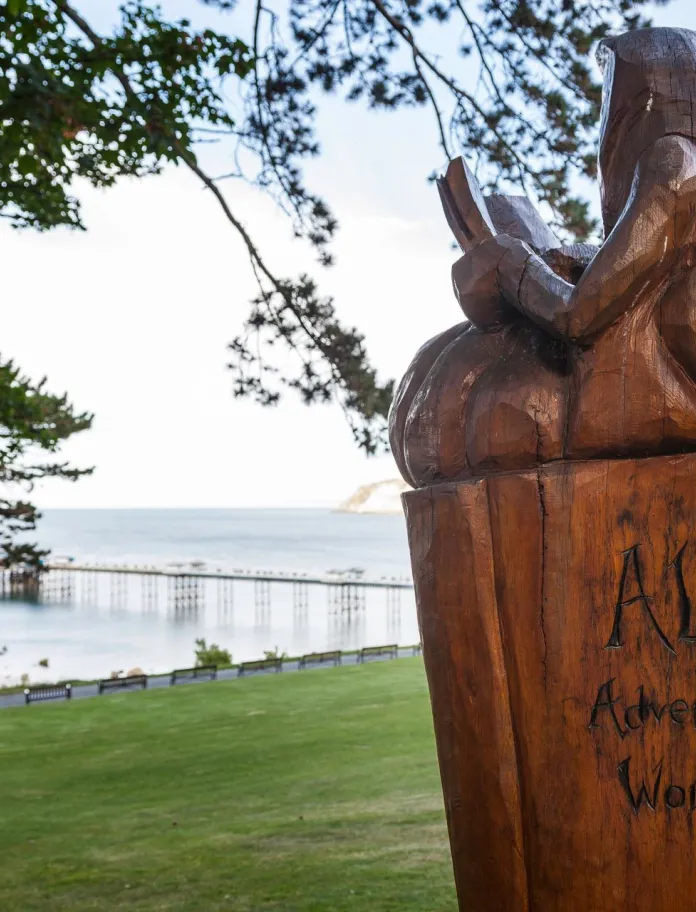 Image of a carved wooden figure from Alice in Wonderland.
