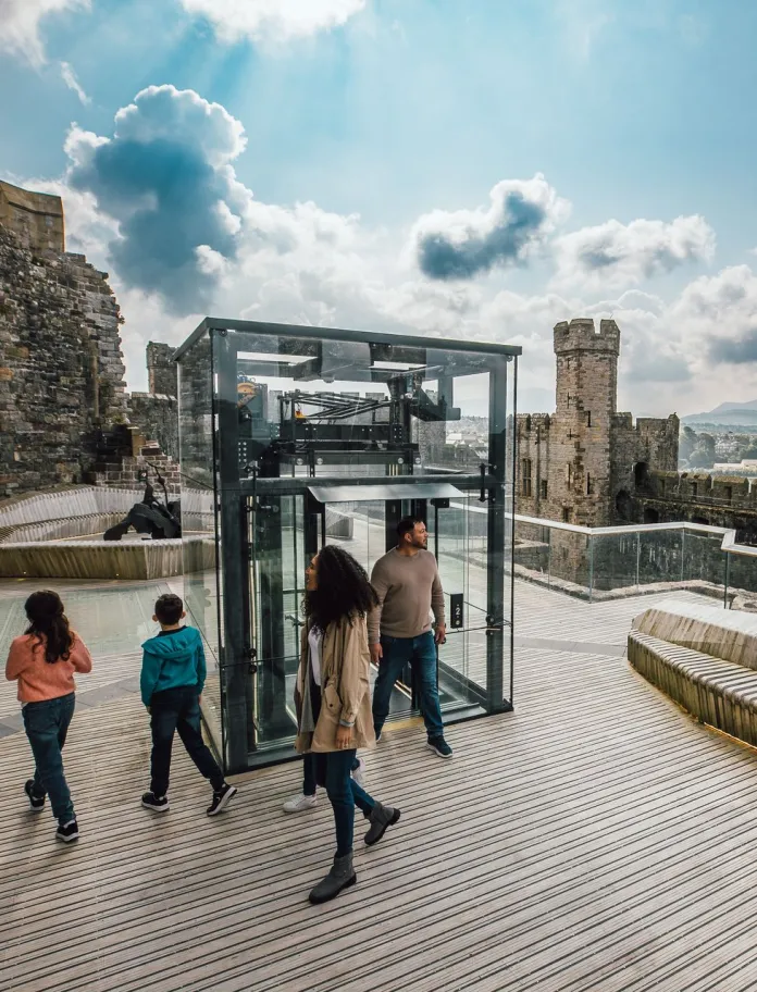 A viewing platform with a lift on the roof on a huge castle. 