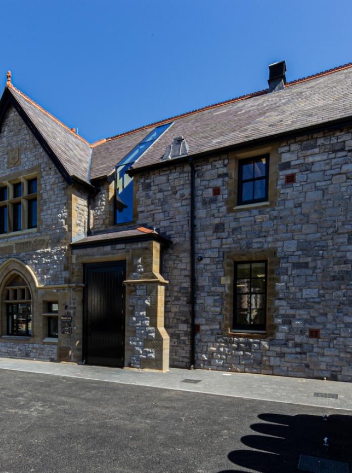 The external view of an old school house converted to a distillery.
