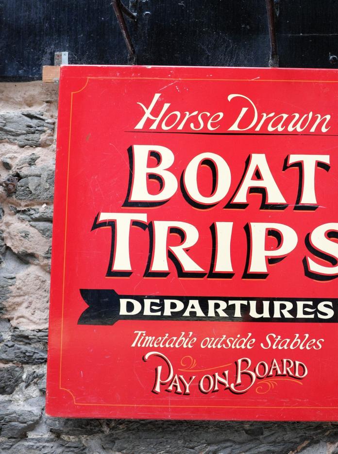Boat trips sign in Llangollen.