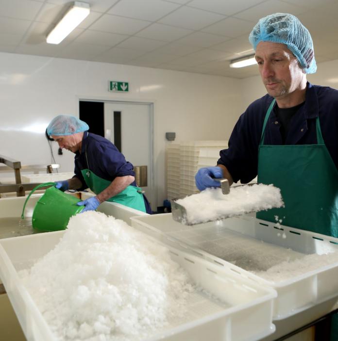 Workers making the salt at Halen Mon Anglesey Sea Salt Company.