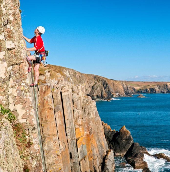 climber climbing 'Kitten Claws' on Carreg y Barcud in Pembrokeshire.