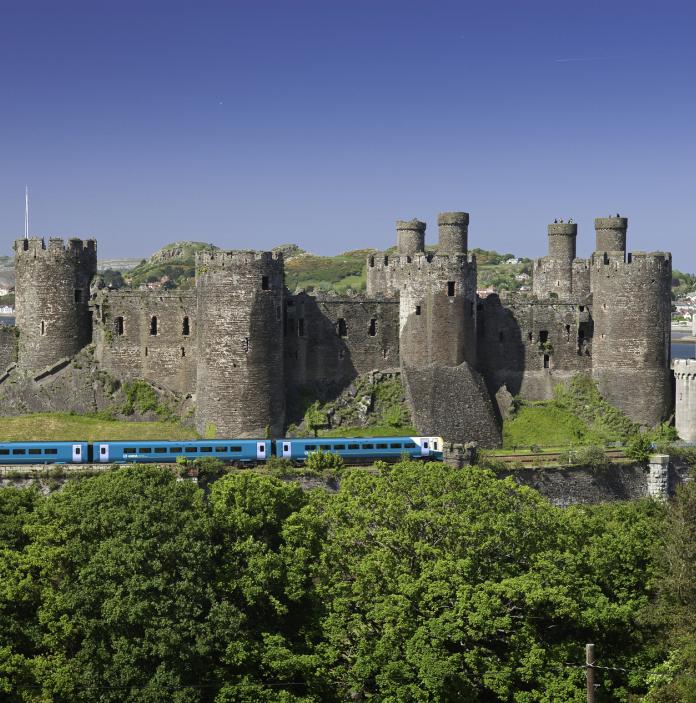 Train going passed Conwy Castle