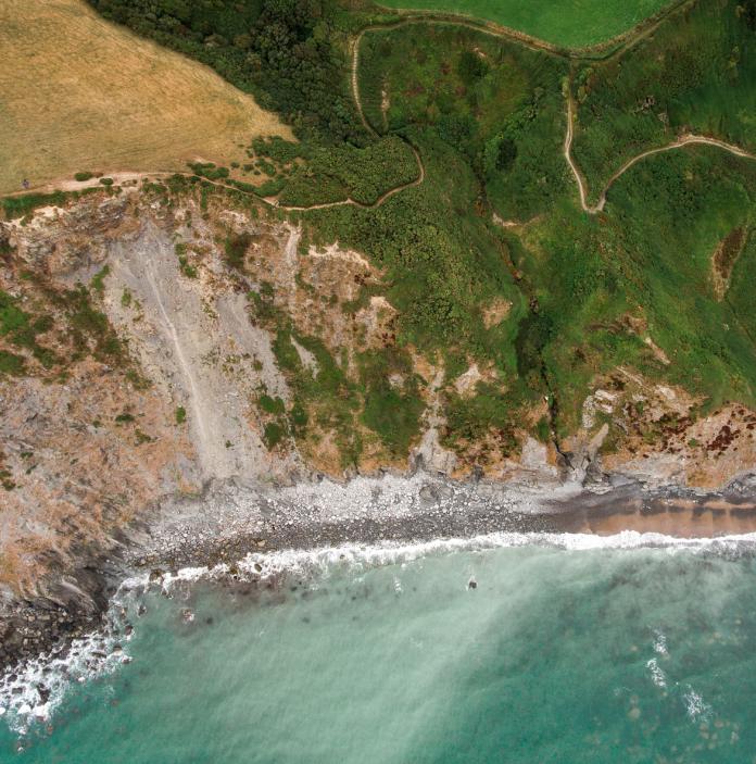 Pathways along the coastline from above.