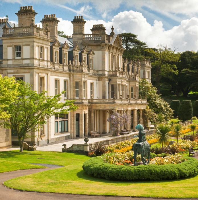 An external shot of the house at Dyffryn Gardens surrounded by greenery.