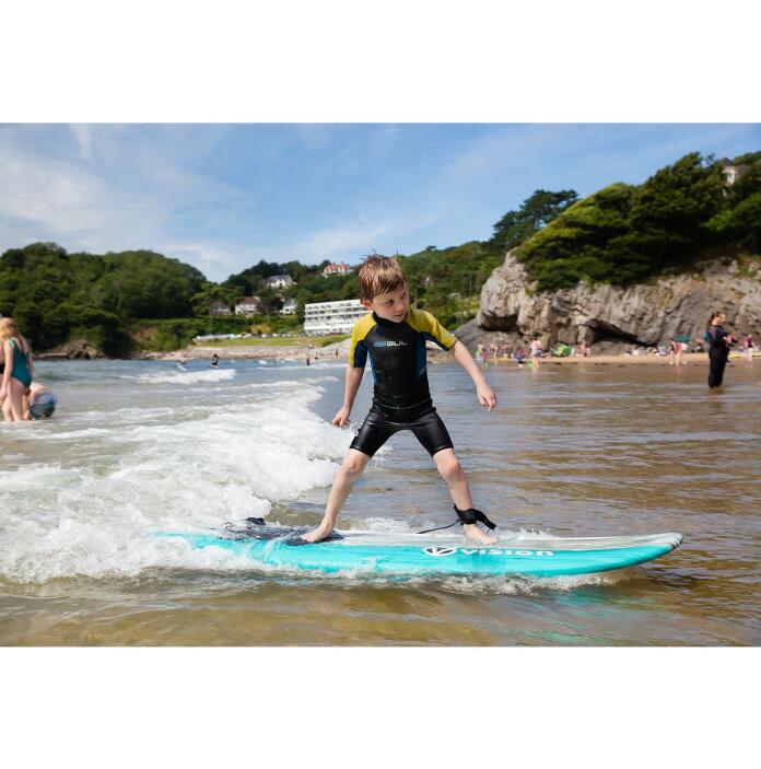 young boy surfing.