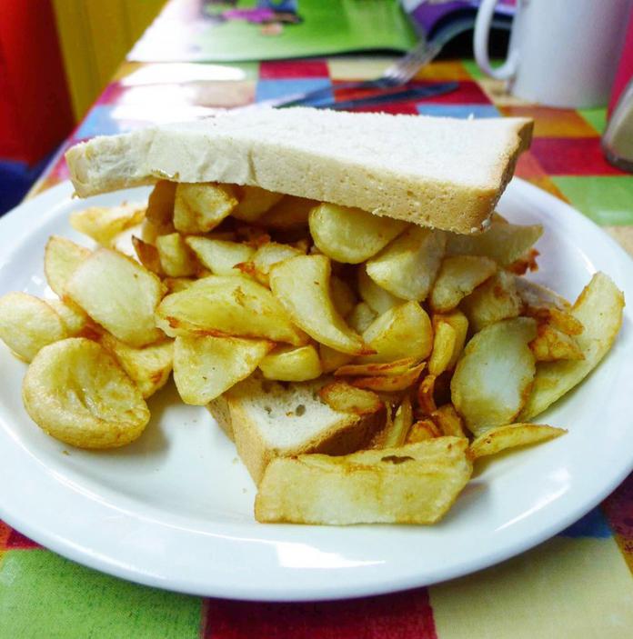 Chip butty on plate.