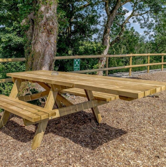 wooden bench with wheelchair access.