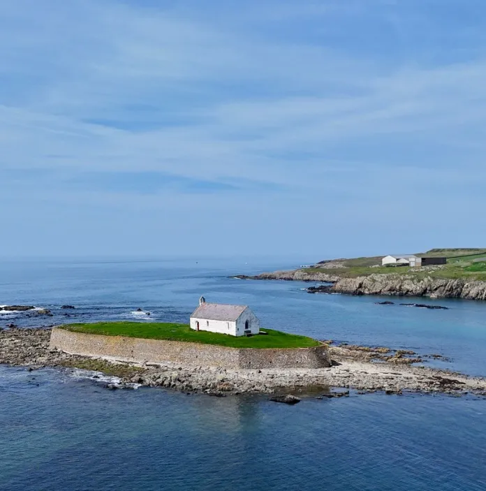 A small church on an island surrounded by sea